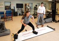Physical therapist and patient working on an exercise.